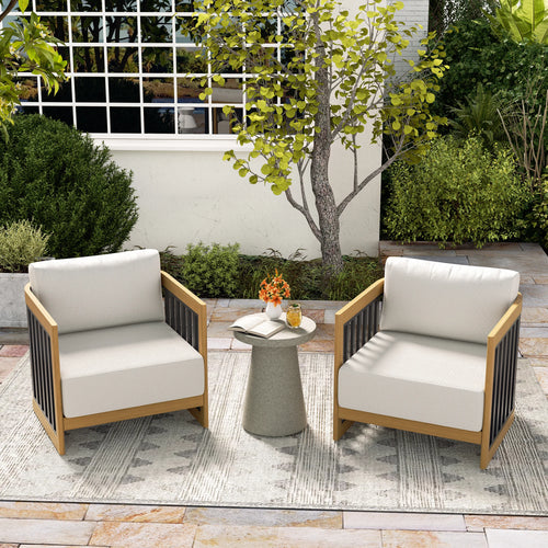 Outdoor patio set with two chairs and a small table on a stone patio.