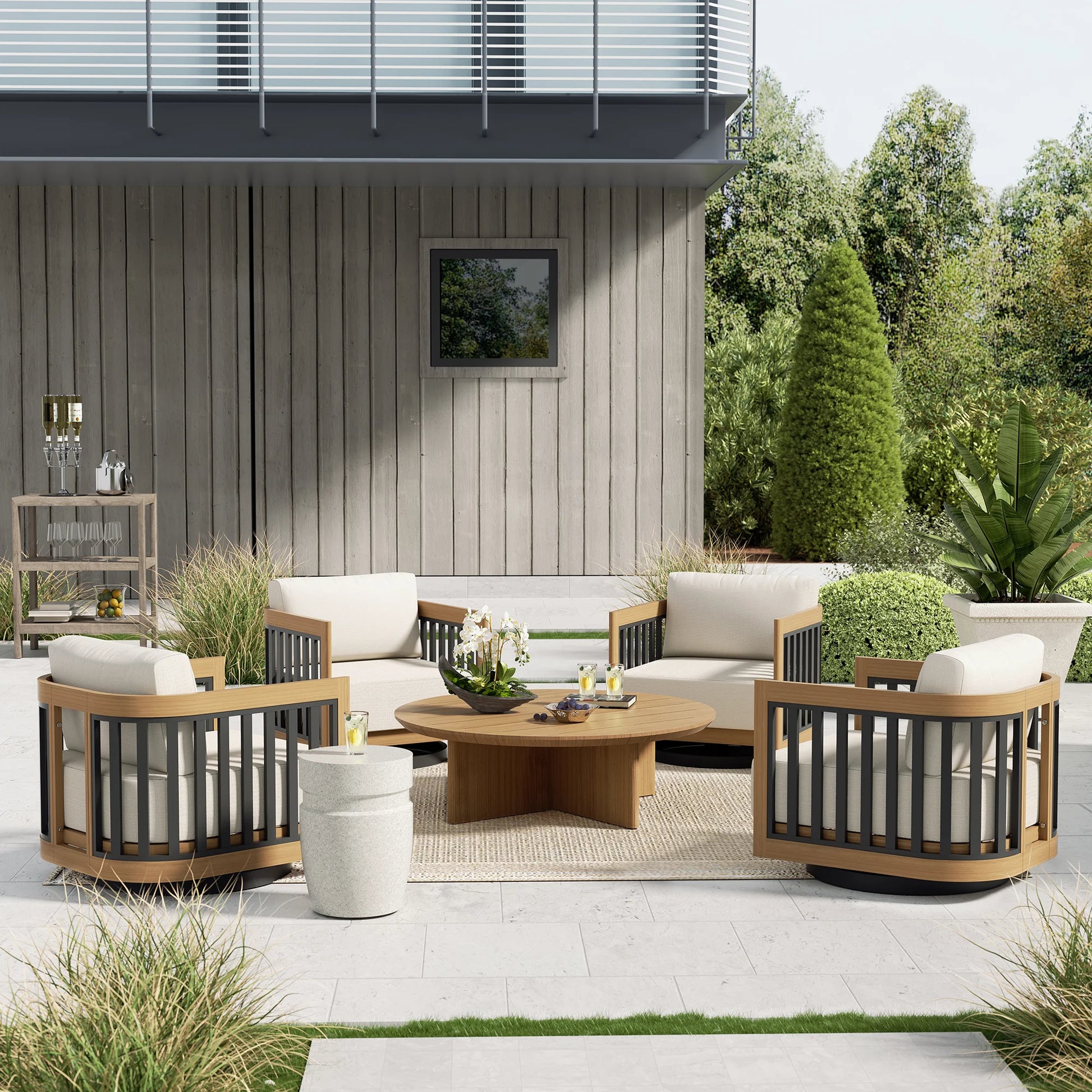Modern outdoor patio set with wooden chairs and table in a garden setting.