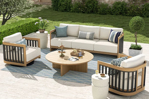 Outdoor patio furniture set with beige sofa, chairs, and coffee table on a patio.
