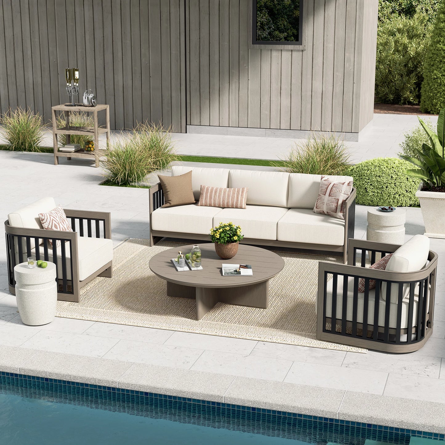 Outdoor patio set with furniture and decor by a pool