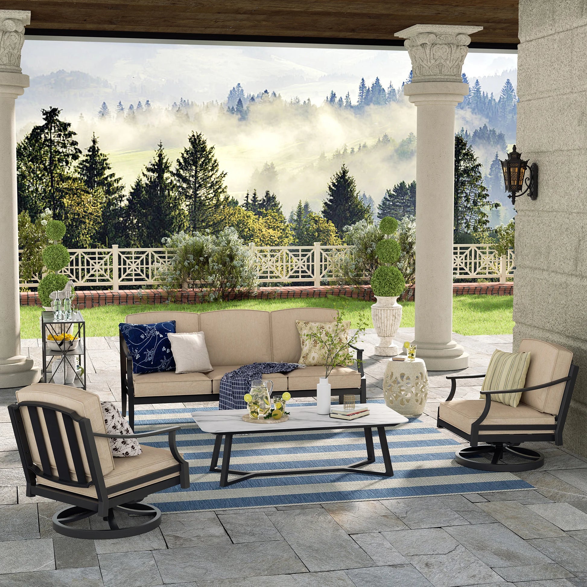 Outdoor patio with furniture and a scenic view of trees and a house.
