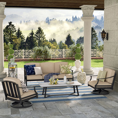 Outdoor patio with furniture and a scenic view of trees and a house.