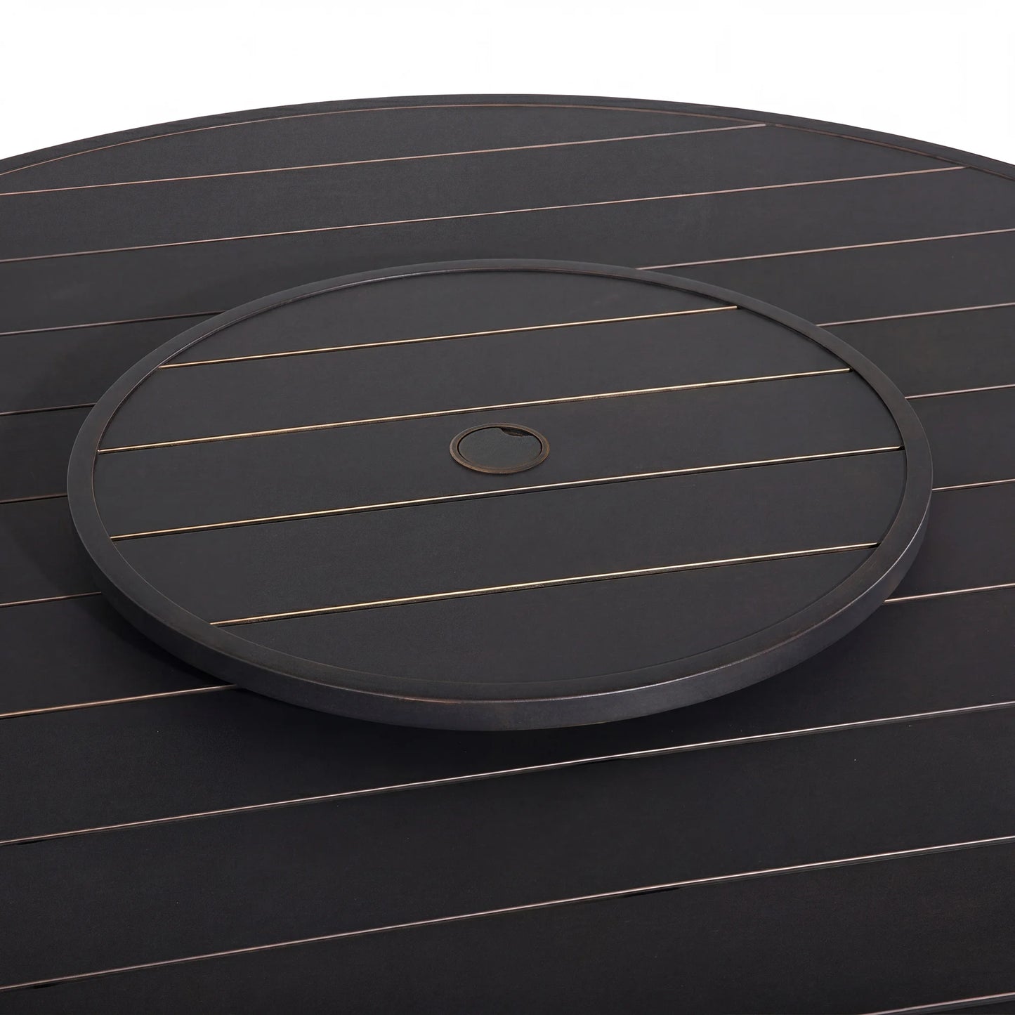 Round black tray with a central hole on a matching dark surface