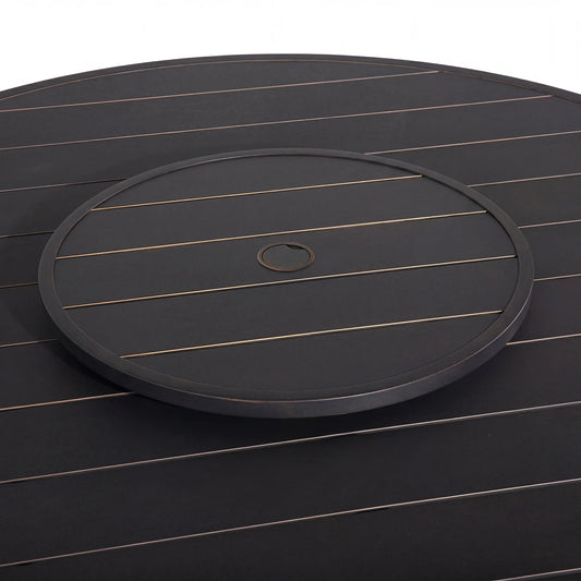 Round black tray with a central hole on a matching dark surface