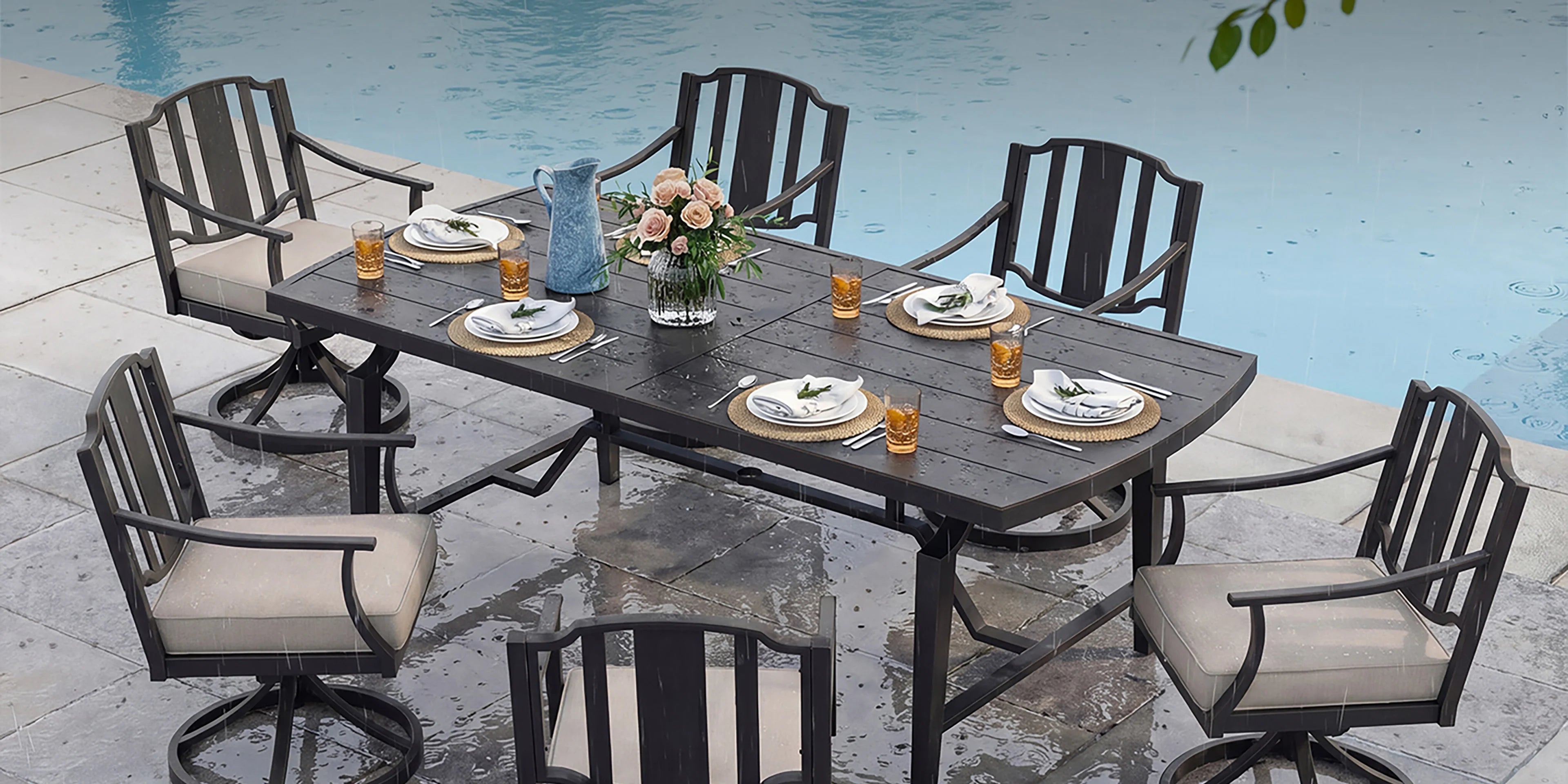 Patio dining set with table and chairs by a pool