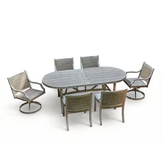 Outdoor dining set with a table and six chairs on a white background