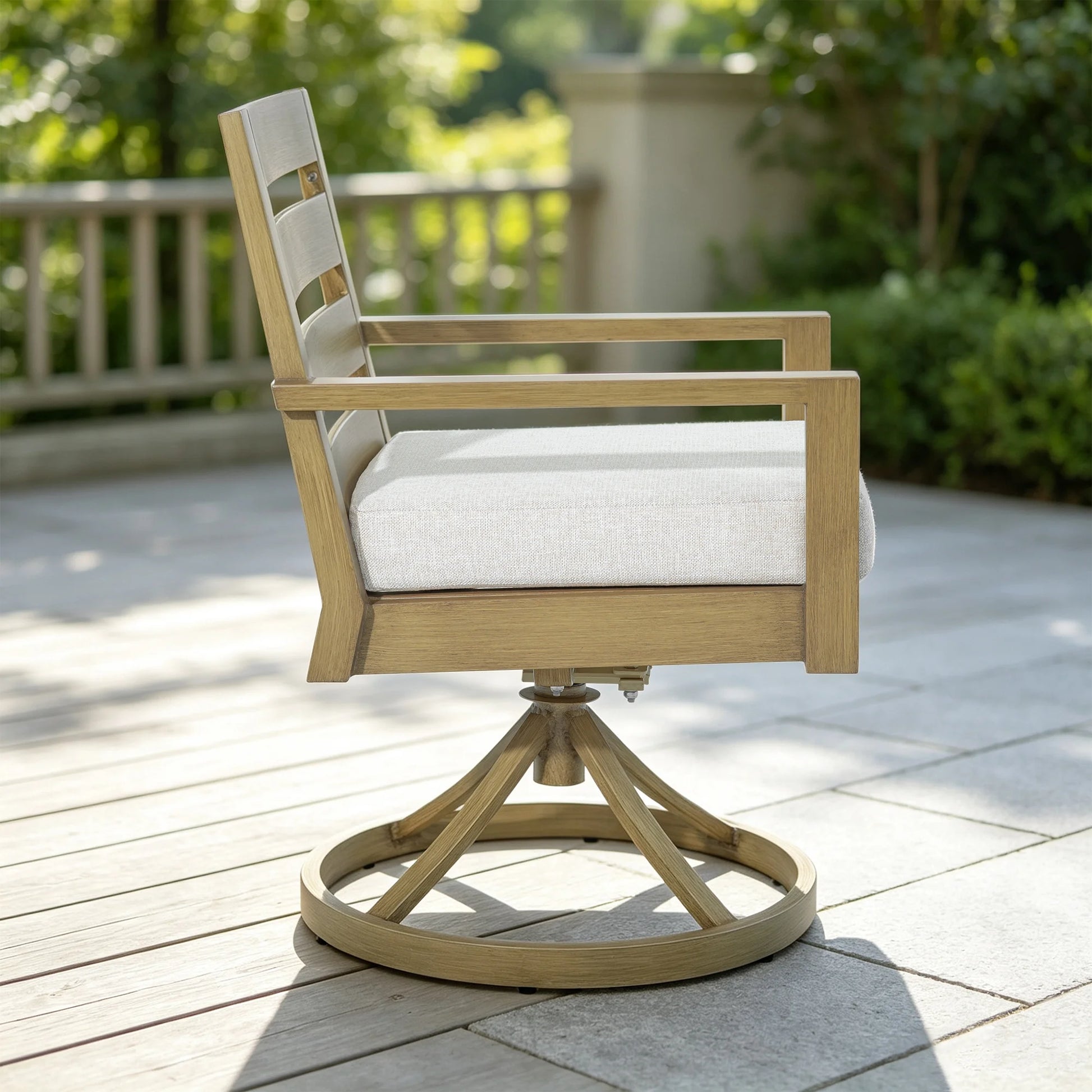 Side profile view of the Alcudia aluminum swivel rocker dining armchair highlighting the 3-inch thick plush foam cushion and curved backrest slats.