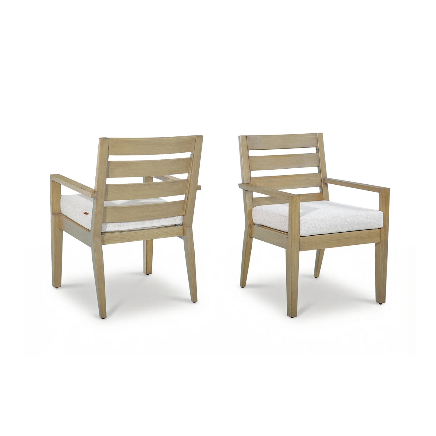Front and back view of a pair of Alcudia aluminum patio dining armchairs with beige cushions isolated on a white background.