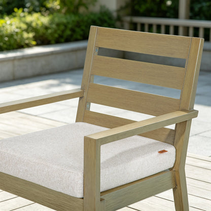 Detailed view of Alcudia modern patio dining chair highlighting the horizontal slat backrest and warm oak finish.