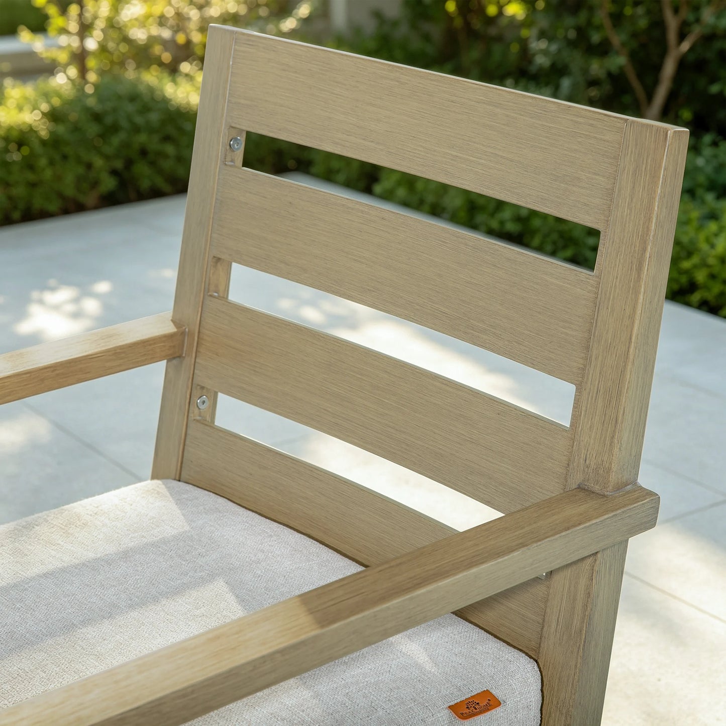 Detailed view of the horizontal slats on the Alcudia patio chair backrest fastened with durable, rust-proof stainless steel screws.