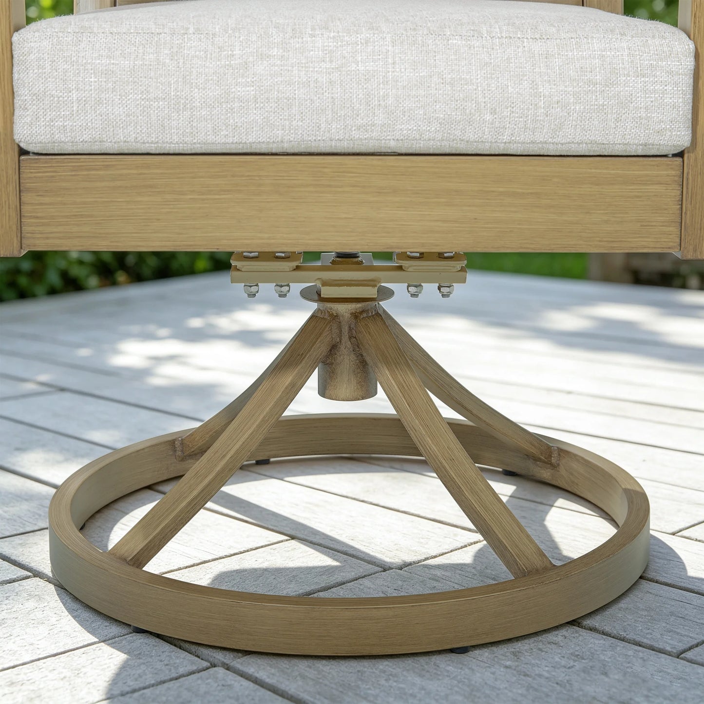 Close-up of the Alcudia heavy-duty chair base showcasing the 15-degree rocking spring plate and rust-free stainless steel bolts and nuts hardware.