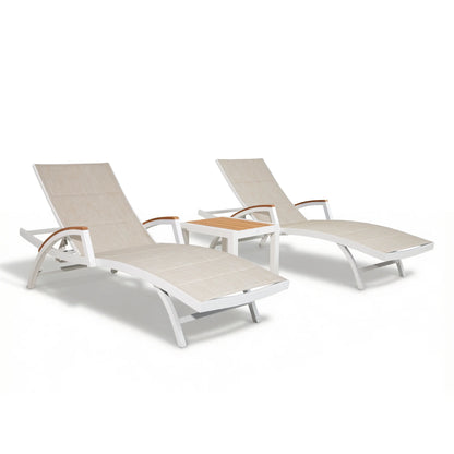 Studio isolation shot of the Chambray 3-piece outdoor chaise lounge set featuring two loungers and one wooden-top side table.