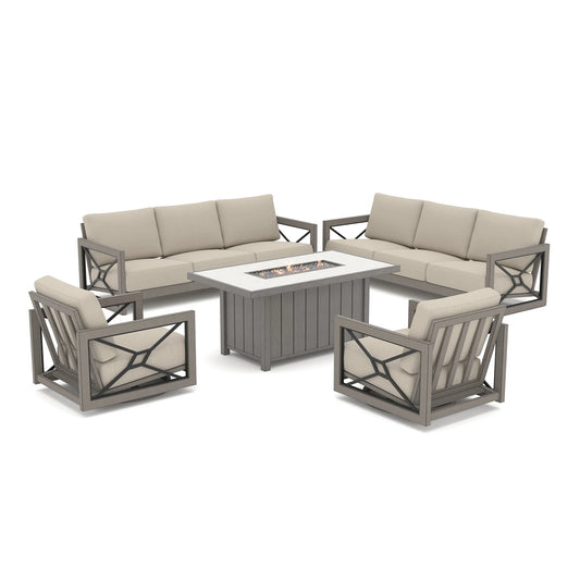 Isolated product shot of the grand Marindo patio deep seating collection against a white background, showcasing active amber flames on the propane fire pit surrounded by two sofas and two swivel chairs.