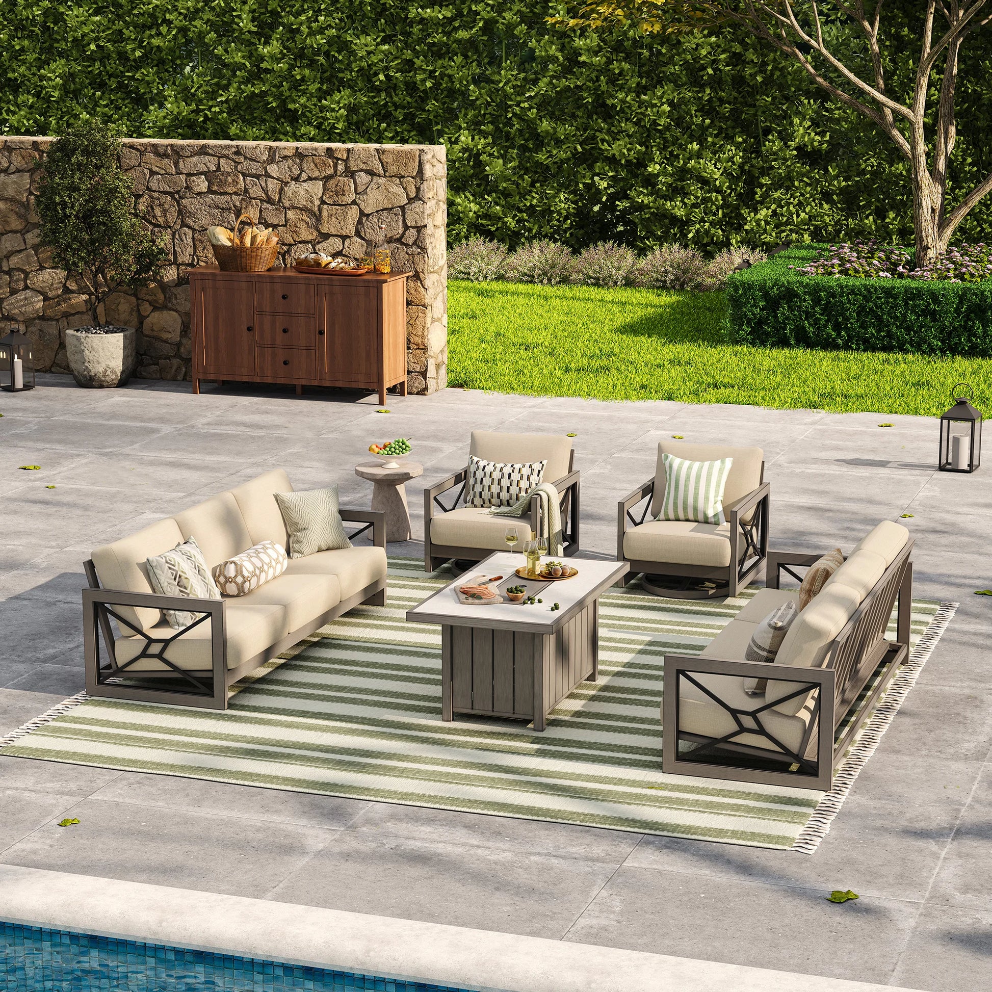 A spacious courtyard layout featuring a low-maintenance outdoor entertaining space during the day, with the Marindo 8-person faux-wood seating set arranged symmetrically over a green striped rug.