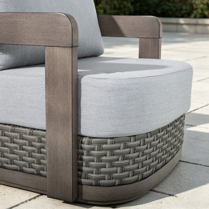 Detailed close-up showing the non-swivel architectural aluminum frame and premium hand-woven gray PE wicker base of the Manarola club chair.
