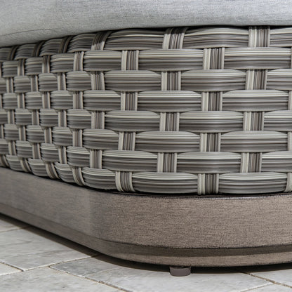 Close-up texture shot of the premium multi-tonal gray PE wicker hand-woven base underneath the non-swivel aluminum frame profile.