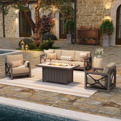 Upscale backyard patio at night featuring the Marindo aluminum outdoor sofa set, with amber flames glowing from the 50,000 BTU stainless steel fire pit table and warm ambient lighting.