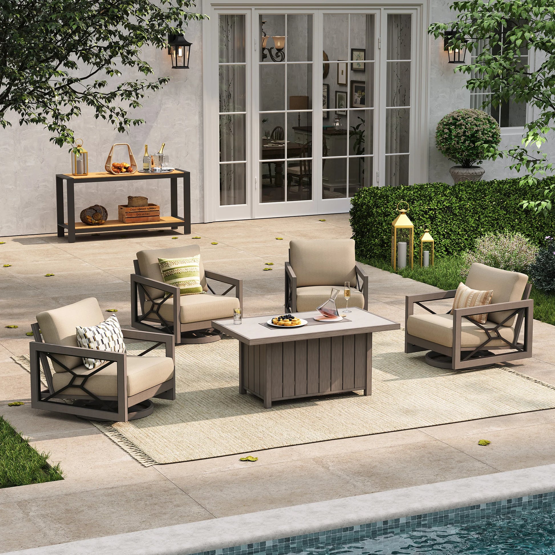 A serene poolside terrace layout providing backyard gathering inspiration, highlighting the Marindo 4-passenger swivel lounge set with beige cushions and a covered center fire table during the day.