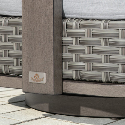 Close-up of the Peak Home Furnishings metal logo plate embedded on the weathered-wood finish aluminum frame.