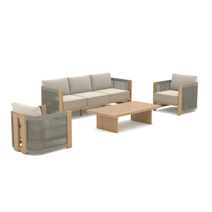 Clean studio setup of the Positano four-piece outdoor furniture collection including one three-seater sofa, two rope-woven armchairs, and a low rectangular coffee table.