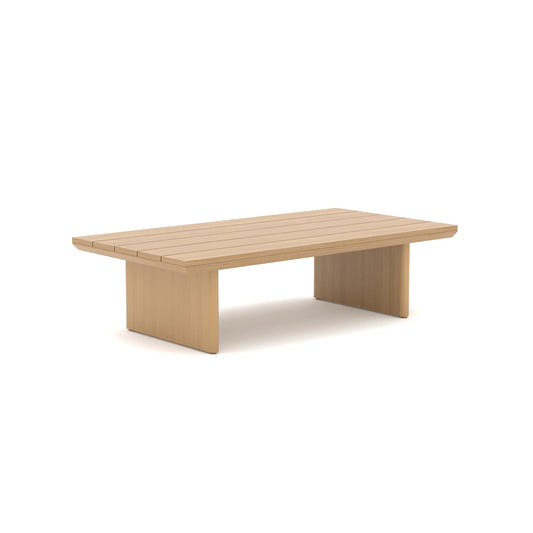 Three-quarter perspective studio shot of a minimalist light-wood finish aluminum outdoor cocktail table against a plain white background.