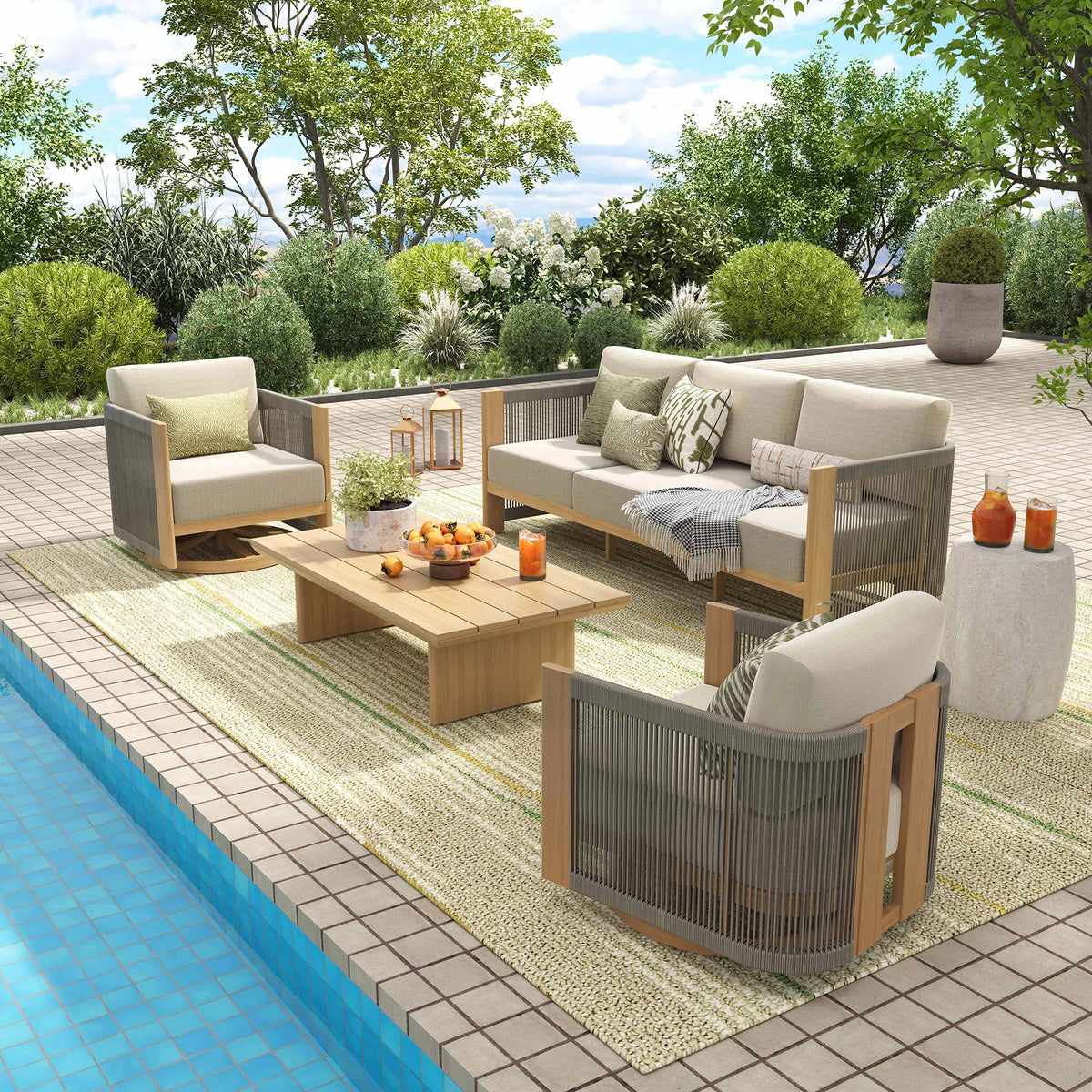 A contemporary sunlit villa terrace styled with an all-weather aluminum rope conversation set next to a swimming pool on a textured beige rug.