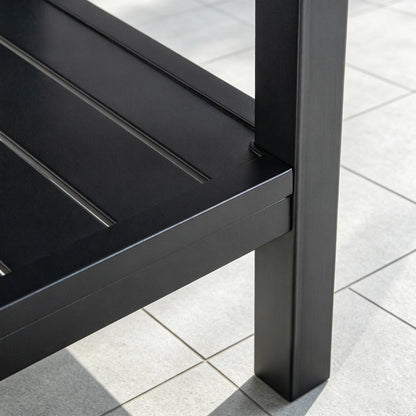 Detailed view of the bottom shelf connection point and heavy-duty welded leg structure of the Saporta accent table.